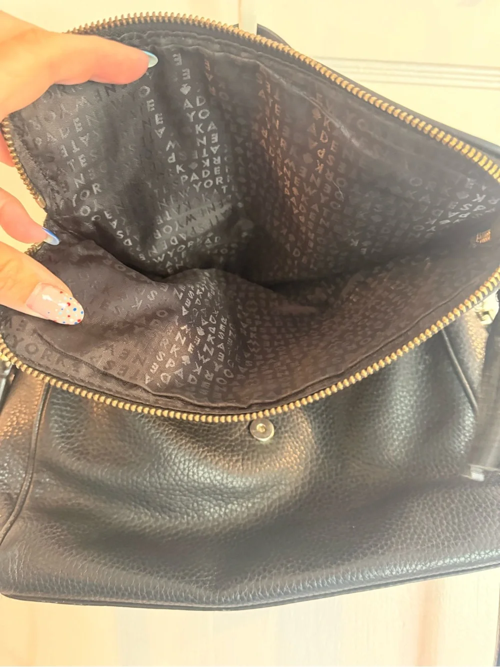 kate spade black pebbled leather shoulder bag with tassel